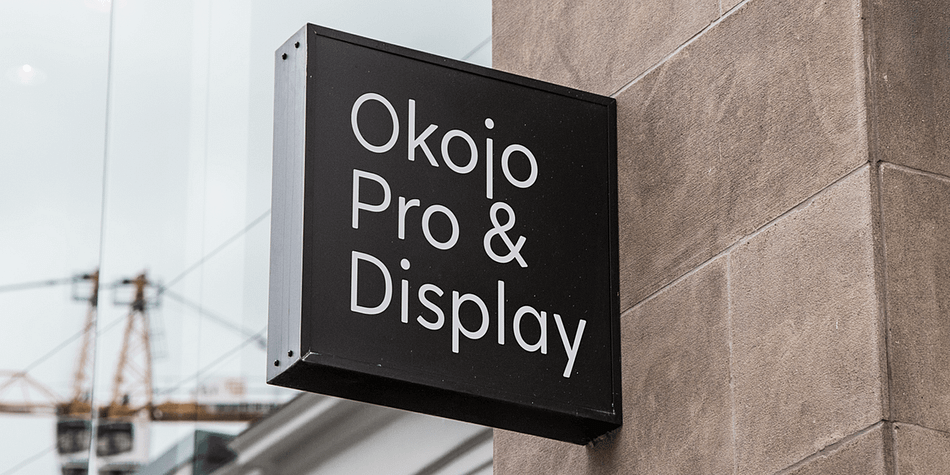 It includes Okojo Pro, a semi-geometric sans serif, Okojo Slab Pro, a semi-geometric slab serif, Okojo Pro Display, a round-cornered sans serif variation, and Okojo Slab Pro Display, a round-cornered slab serif.